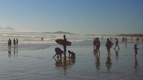 View of people enjoying at beach