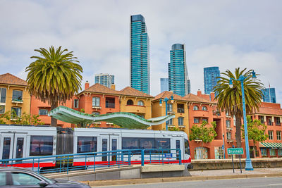 Buildings in city against sky