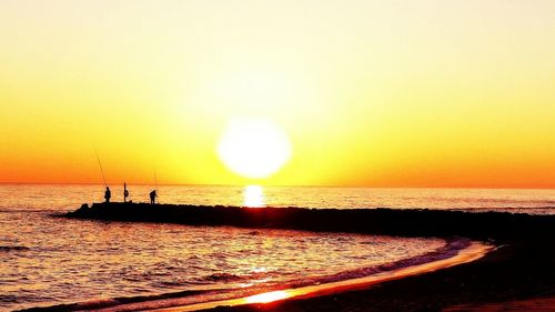 Scenic view of sea at sunset