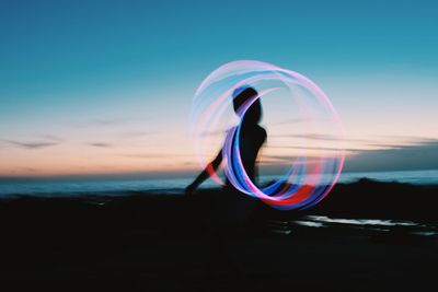 Close-up of light trails at sunset