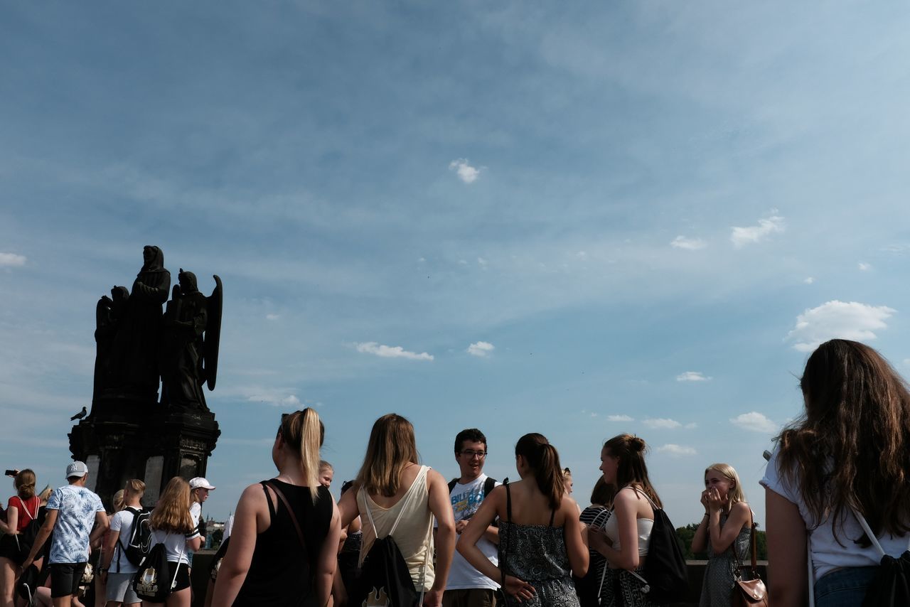 GROUP OF PEOPLE ON THE COAST