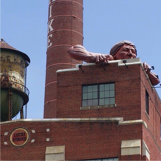 building exterior, architecture, built structure, low angle view, clear sky, tower, blue, copy space, day, outdoors, city, history, bird, no people, window, sunlight, building, brick wall, tall - high, famous place