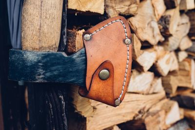 Close-up of metal against logs