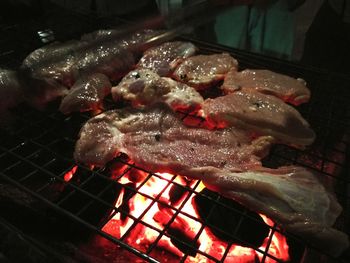 Close-up of meat on barbecue grill