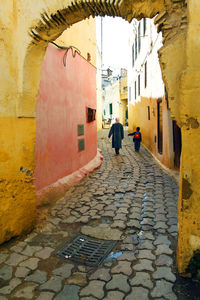 People on cobblestone street