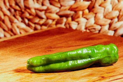 Close-up of green chili on table