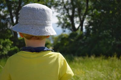 Rear view of boy in hat
