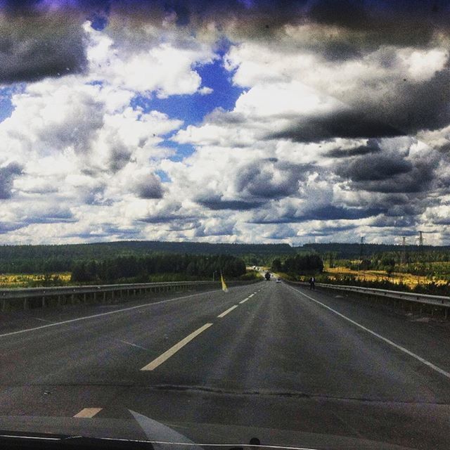 transportation, road, sky, the way forward, road marking, cloud - sky, cloudy, diminishing perspective, mode of transport, vanishing point, cloud, land vehicle, car, country road, windshield, vehicle interior, glass - material, highway, landscape, transparent