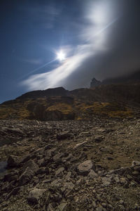 Scenic view of landscape against sky at night