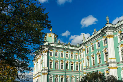 Low angle view of building against blue sky