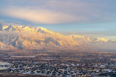 High angle view of snowcapped mountain against sky