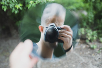 Portrait of woman photographing