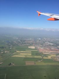 Airplane wing against sky