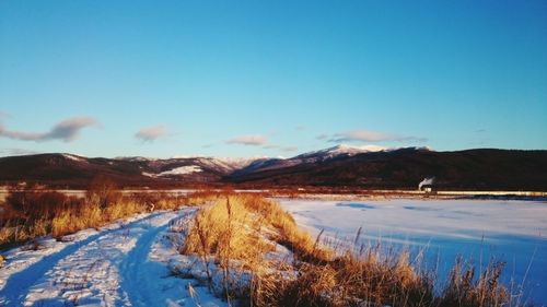 Scenic view of mountains against sky during winter