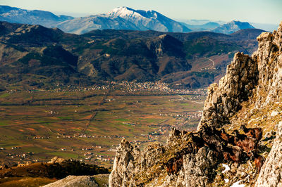 Scenic view of landscape and mountains against sky