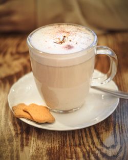Close-up of cappuccino served on table