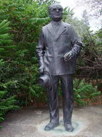 Statue against trees