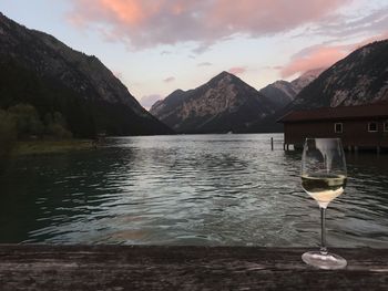 Scenic view of lake and mountains against sky