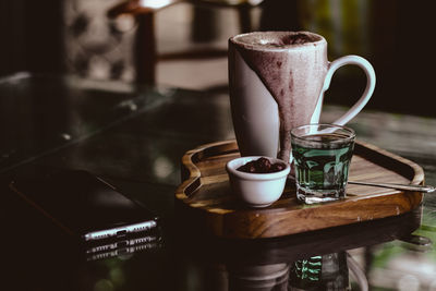 Close-up of coffee cup on table