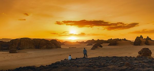 Scenic view of valley against sky during sunset. 