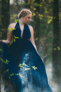Young woman wearing blue dress