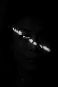 Close-up portrait of girl in the dark