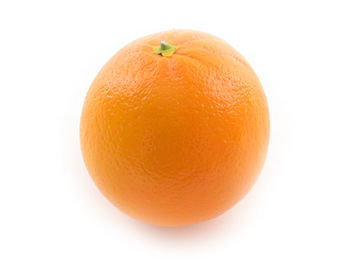 Close-up of orange over white background