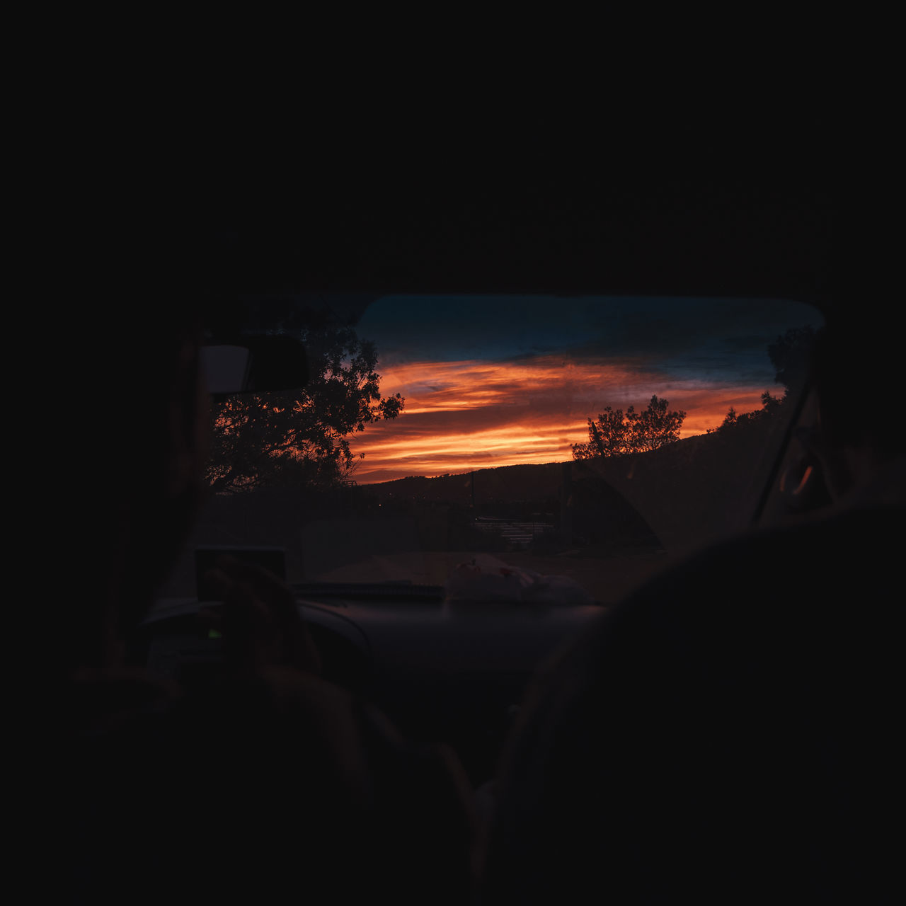 SILHOUETTE CAR AGAINST SKY AT SUNSET