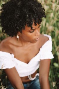 Young black woman relaxing in the grass