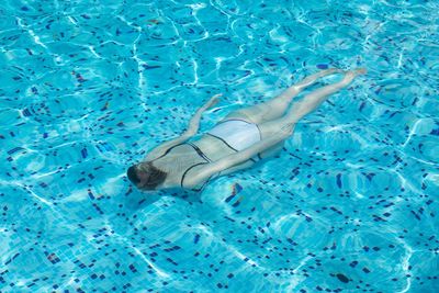 High angle view of person swimming in pool