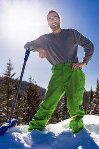 Full length of young man standing on snow