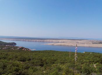 Scenic view of sea against clear blue sky