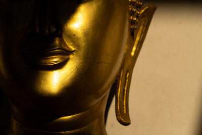 Close-up of buddha statue in temple