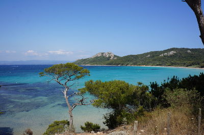 Scenic view of sea against blue sky