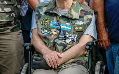 Low section of man sitting in traditional clothing