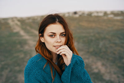 Portrait of beautiful woman standing outdoors