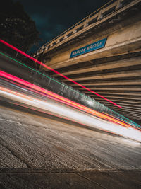 Light trails on road in city at night