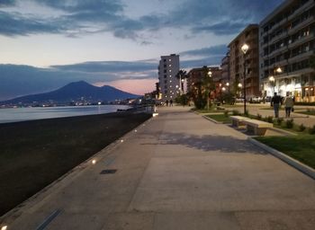 Illuminated city against sky at night