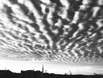 Low angle view of building against cloudy sky