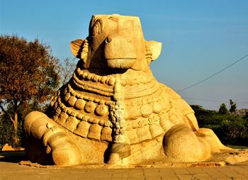 Statue of buddha against clear sky