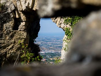 Scenic view of rock formation in sea against sky