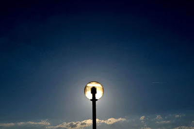 Low angle view of street light against sky at night