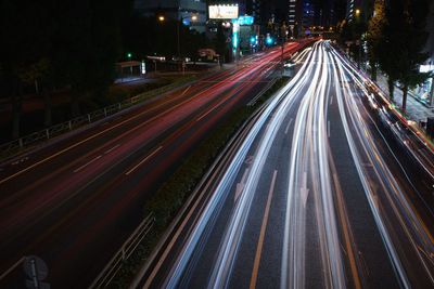 High angle view of light trails on road at night