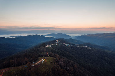 Scenic view of mountain range against sky during sunset