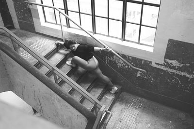 High angle view of woman on staircase