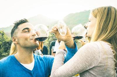 Panoramic shot of beer drinking glasses against sky