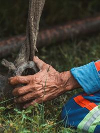 Low section of man working on field