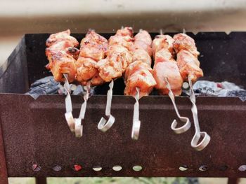 Close-up of meat on barbecue grill