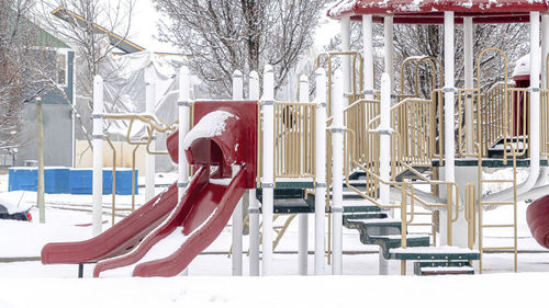 Empty benches in park during winter