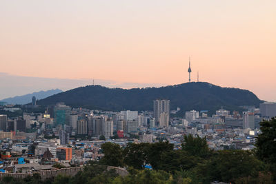 High angle view of buildings against sky during sunset